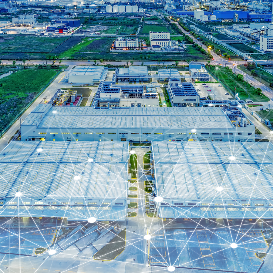 Letecký pohľad na moderný firemný areál so znázornenou digitálnou sieťou, symbolizujúcou spoľahlivé a bezpečné pripojenie v rámci služby Campus Networks od T Business.